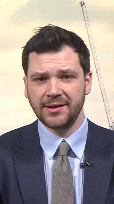 Henry Zeffman wearing a suit and tie 