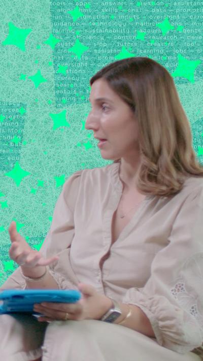 Woman speaks to someone out of shot to her left