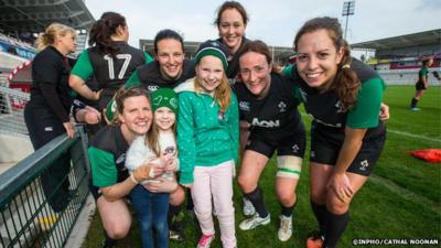 Ireland women's rugby union team with young fans