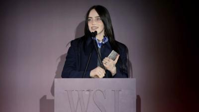 Billie Eilish accepting WSJ award on stage