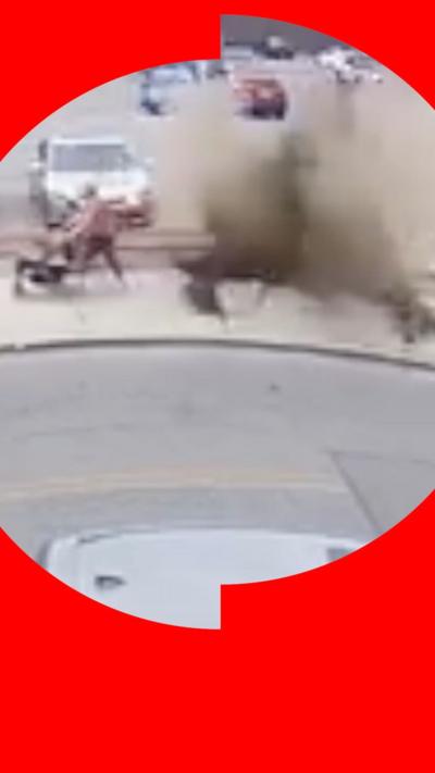 An explosion next to someone pushing a push chair