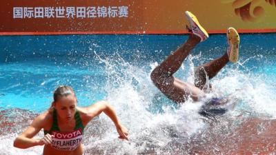 Panama runner Rolanda Bell disappears underwater in the 3000m steeplechase