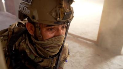 Afghan police officer in training exercise