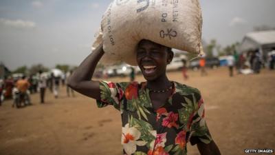 Woman getting food aid