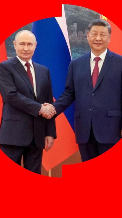Putin and Xi shaking hands
