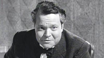 A black and white image of Orson Welles.