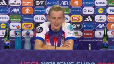 Chloe Kelly speaking during press conference and smiling