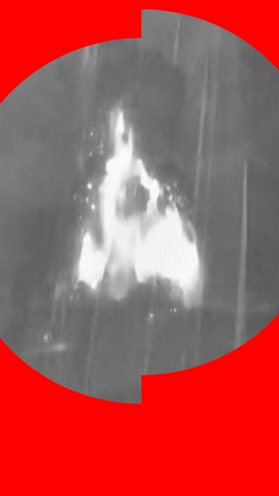 A black and white image showing a thermal image of a volcano erupting
