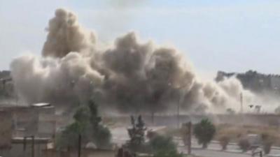 Smoke rises after an airstrike in Aleppo