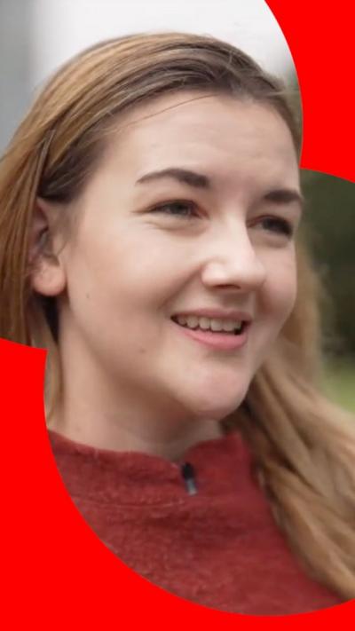 A blonde woman smiling