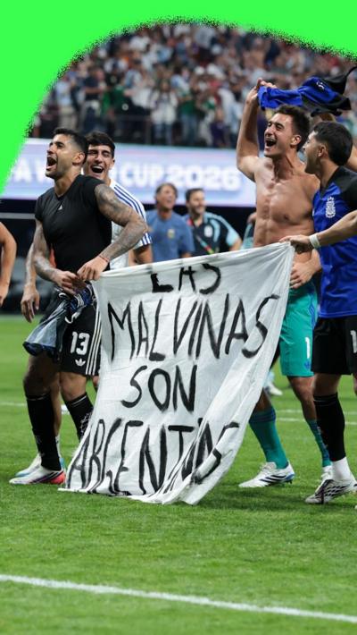 Argentina players hold a Falklands flag after their World cup semi-final against England