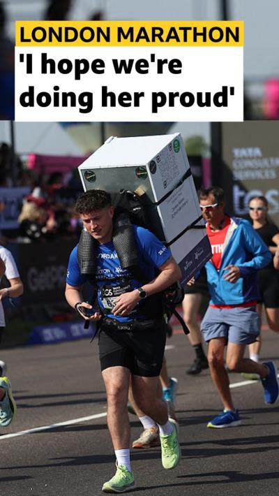 Jordan Adams running with a fridge on his back