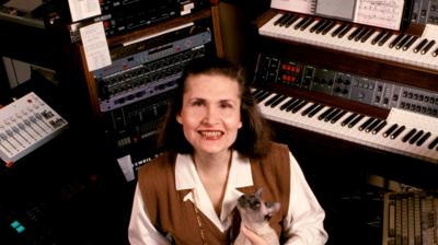 Image of women surrounded by keyboards