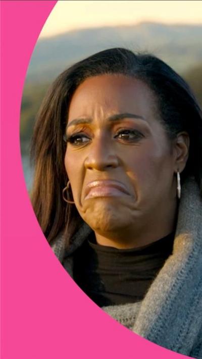 Alison Hammond sitting outside speaking with Jimmy Carr