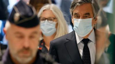 Francois Fillon and his wife Penelope Fillon arrive in court in Paris on 29 June 2020