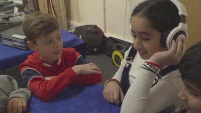 Children listening to music.