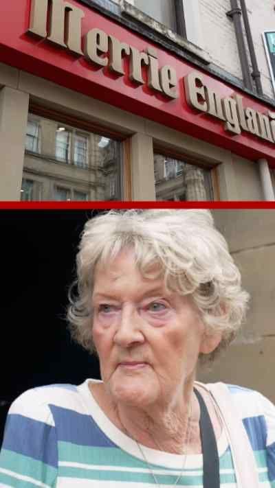 The Merrie England cafe sign alongside a woman with a striped top and blonde curly hair 