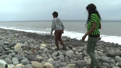 Woman and child on beach in Reunion