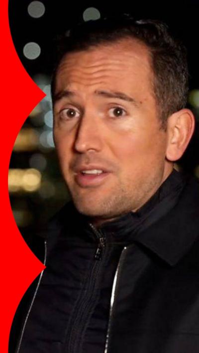 Hugo Bachega looking at camera at night