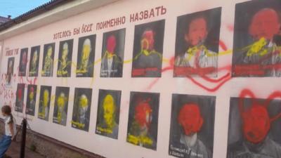 Paintings of Stalin's victims defaced