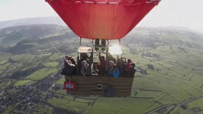 Hot air balloon above countryside