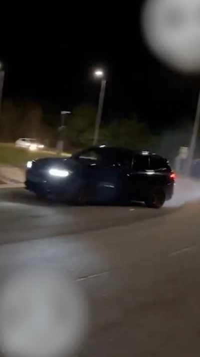 A speeding car at night
