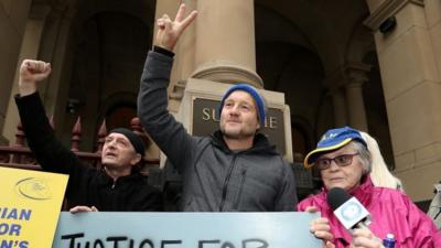 Activists cheering at Pell court decision