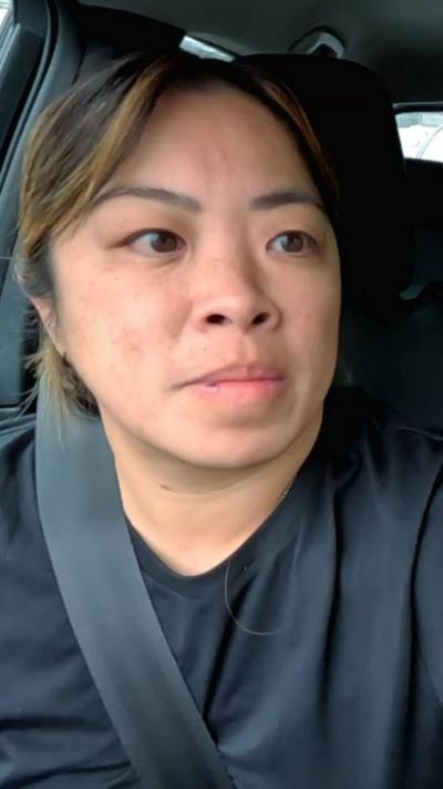 Lady in a car wearing a seatbelt