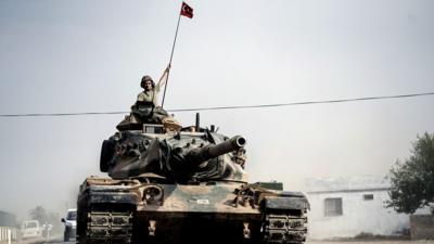 A Turkish tank on its way to the Syrian border