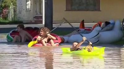 children in dinghies