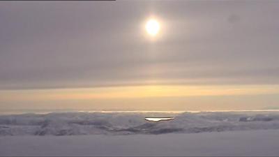 Sun over a frozen landscape