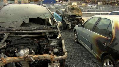 Two of the fire-damaged cars