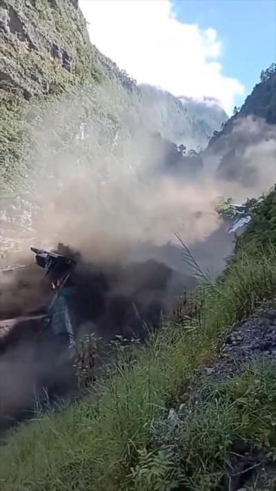 Dam broken apart as it is destroyed by violent flood