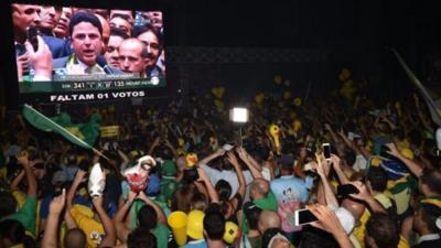 Crowds watch the MPs vote