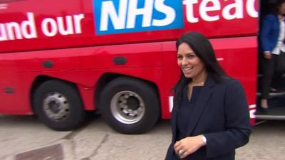 Priti Patel beside the Vote Leave battle bus