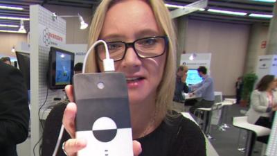 BBC Click's Kate Russell holds a graphene powered charger pack