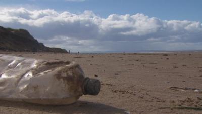 Plastic bottle on a beach.
