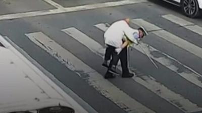 Man on policeman's back