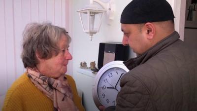 Faz with a clock and a woman