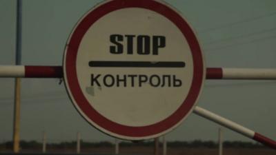 A stop sign at the border checkpoint