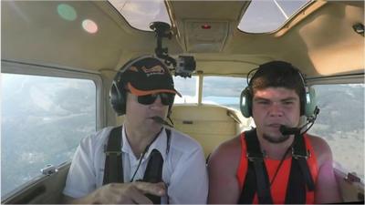 Pilot Paul Simmons with patient Jacob Ling in the cockpit