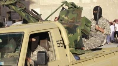 So-called Islamic State militants on an armoured pick-up truck