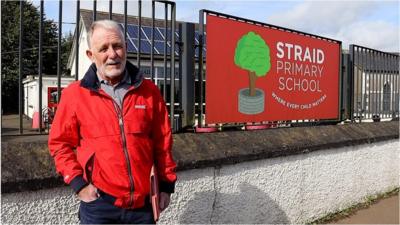 Community leader outside school