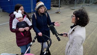 Jennifer Jones speaking to people in Roald Dahl Plass in Cardiff Bay