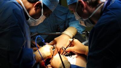 Surgeons operating