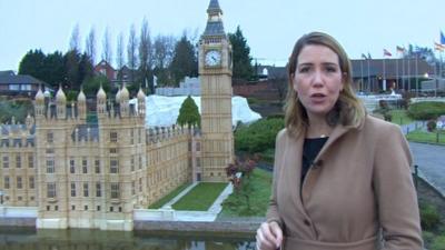 Alex Forsyth in front of model of Palace of Westminster in Brussels' mini-Europe