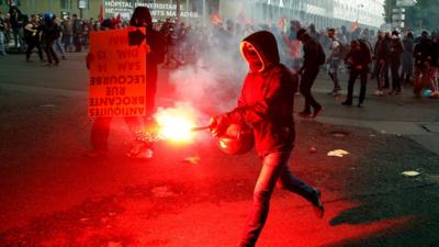 Protesters clash with anti-riot police