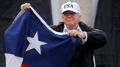 Donald Trump holds Texas flag