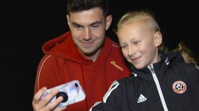 John Egan has a photo with a fan