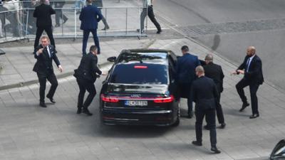 Security officers bundle prime minister into car